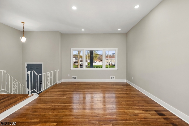 641 Ydv-ham Sq Road Robbinsville, NJ 08691 - Photo 8 of 49 a view of an empty room with wooden floor and windows