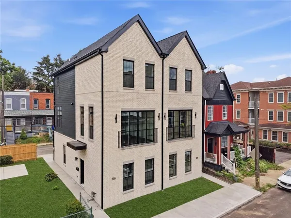 a view of a brick house with an outdoor space
