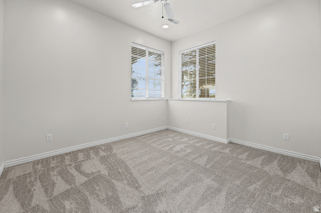 4117 North Wolf Ridge Circle Eden, UT 84310 - Photo 32 of 63 Carpeted room with a ceiling fan, recessed lighting, and two windows featuring blinds