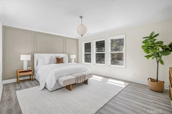 a bedroom with bed and a window