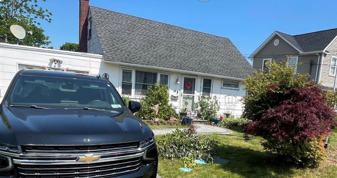 a car parked in front of a house