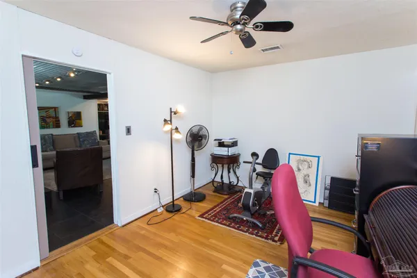 a bed room with a bed and a desk