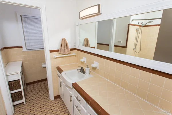 a bathroom with a sink and a mirror