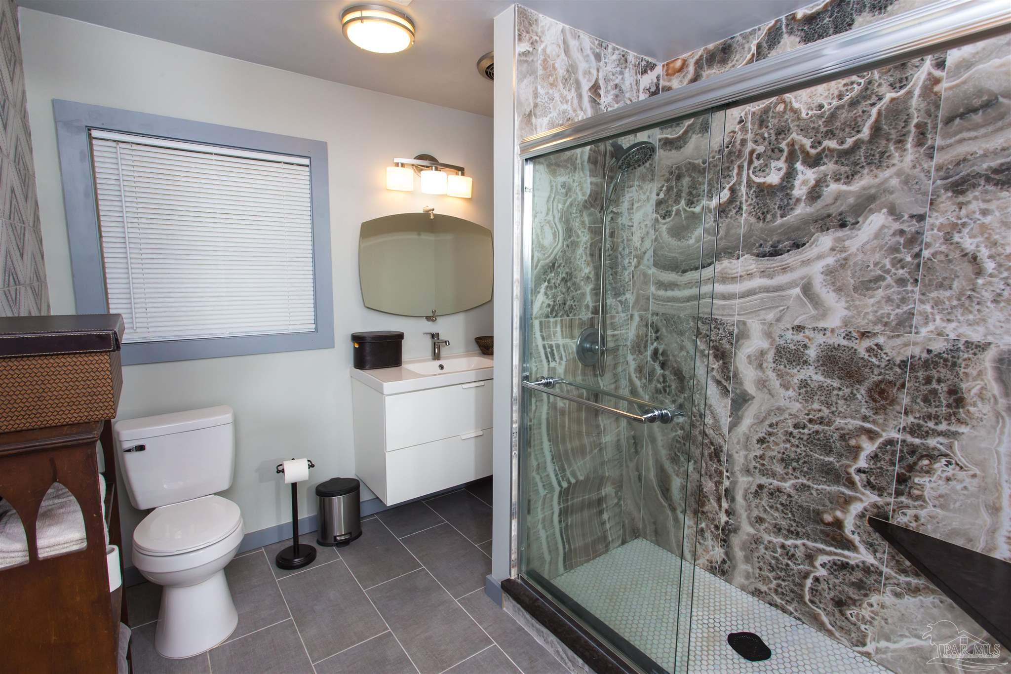 4415 Piedmont Road Pensacola, FL 32503 - Photo 26 of 43 a bathroom with a toilet and a shower