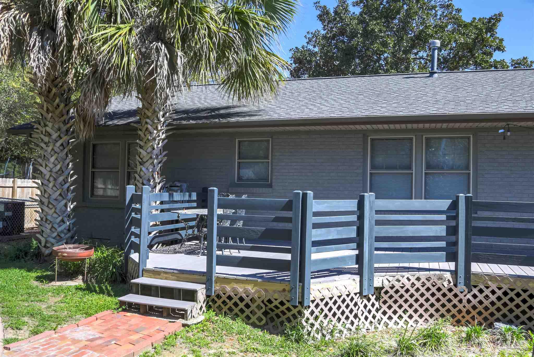 4415 Piedmont Road Pensacola, FL 32503 - Photo 31 of 43 a front view of a house with a garden