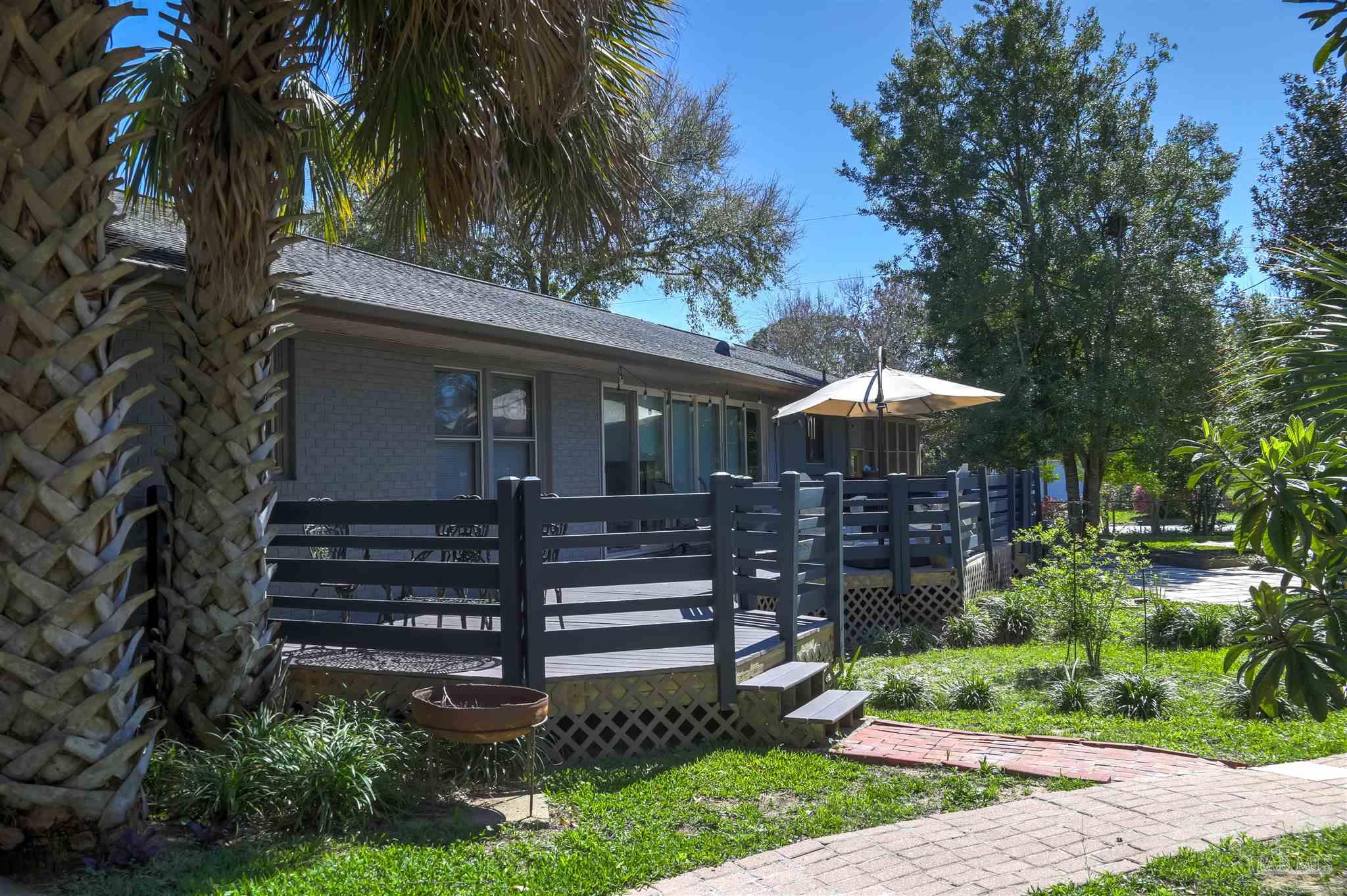 4415 Piedmont Road Pensacola, FL 32503 - Photo 32 of 43 a front view of a house with a garden