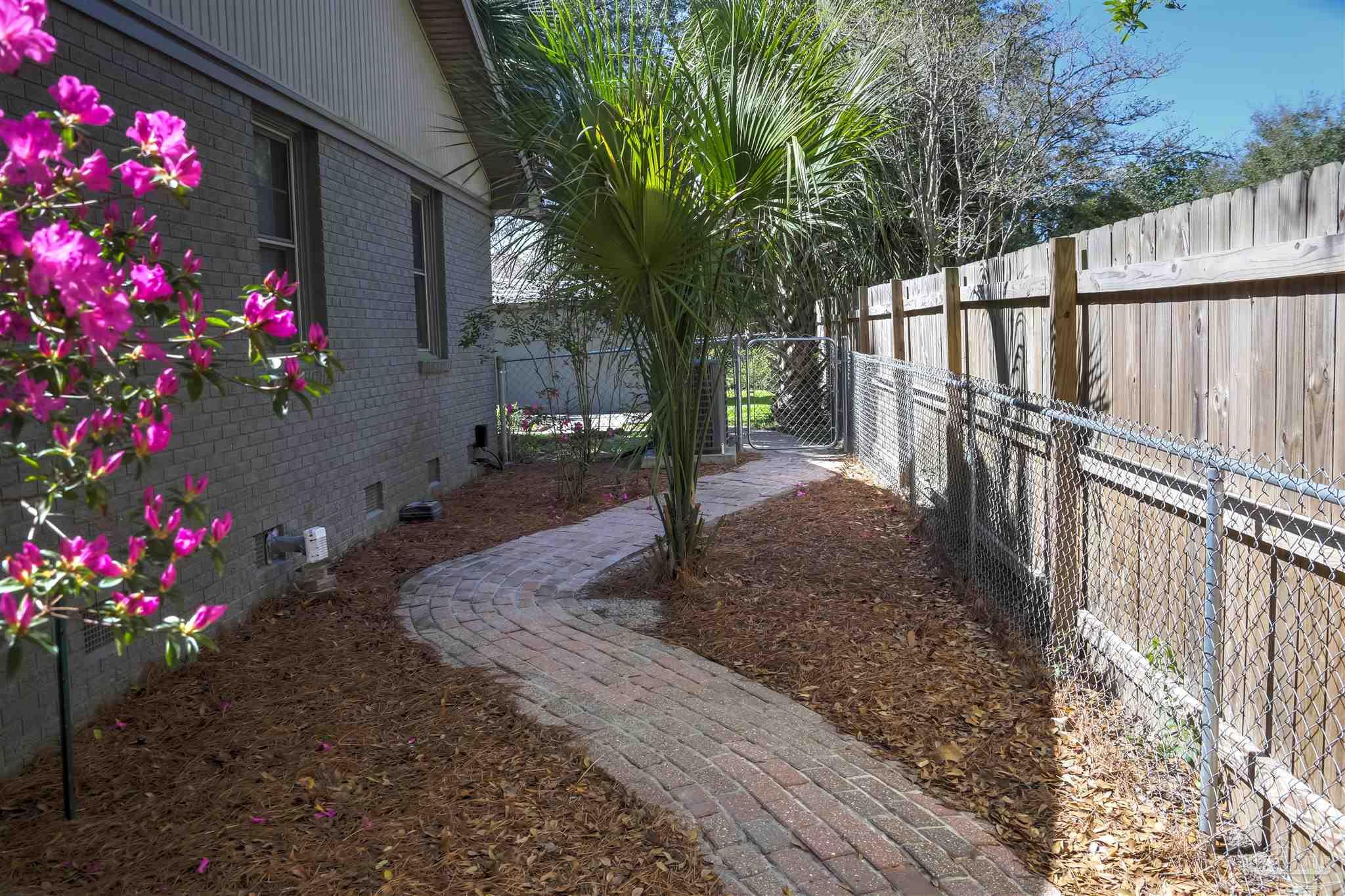 4415 Piedmont Road Pensacola, FL 32503 - Photo 37 of 43 a view of street with flower plants