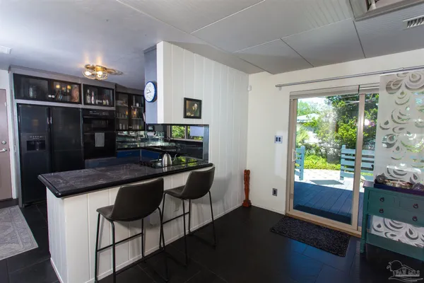 a kitchen with stainless steel appliances granite countertop a stove and a refrigerator