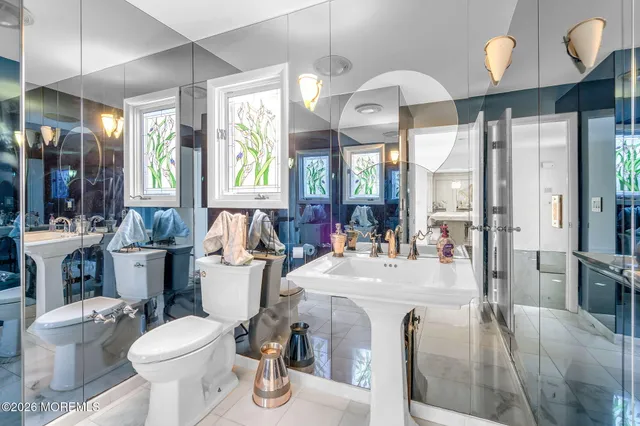 a very nice looking living room with a large window and wooden floor