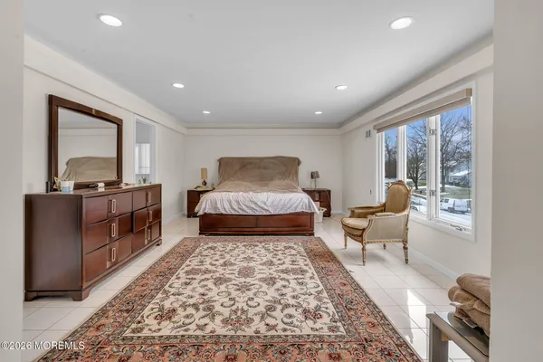 a living room with furniture and a rug