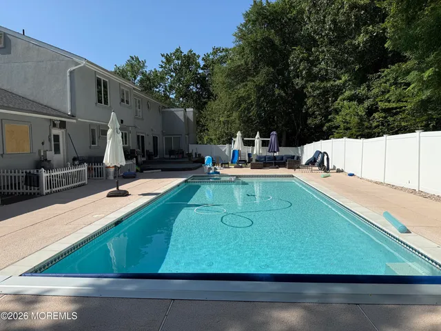 a view of a swimming pool with a patio