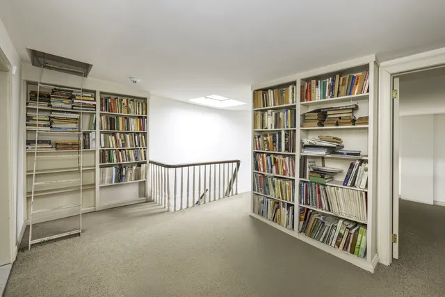 a view of an empty room with shelves