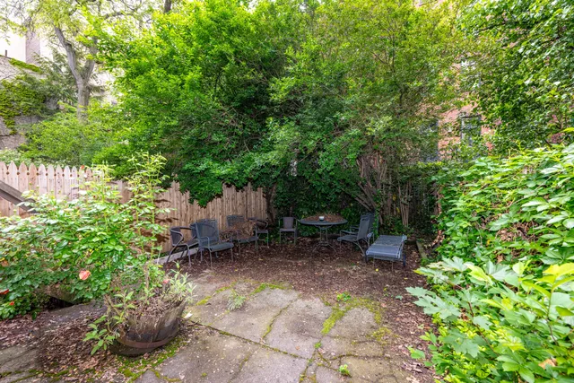 a garden view with a seating space