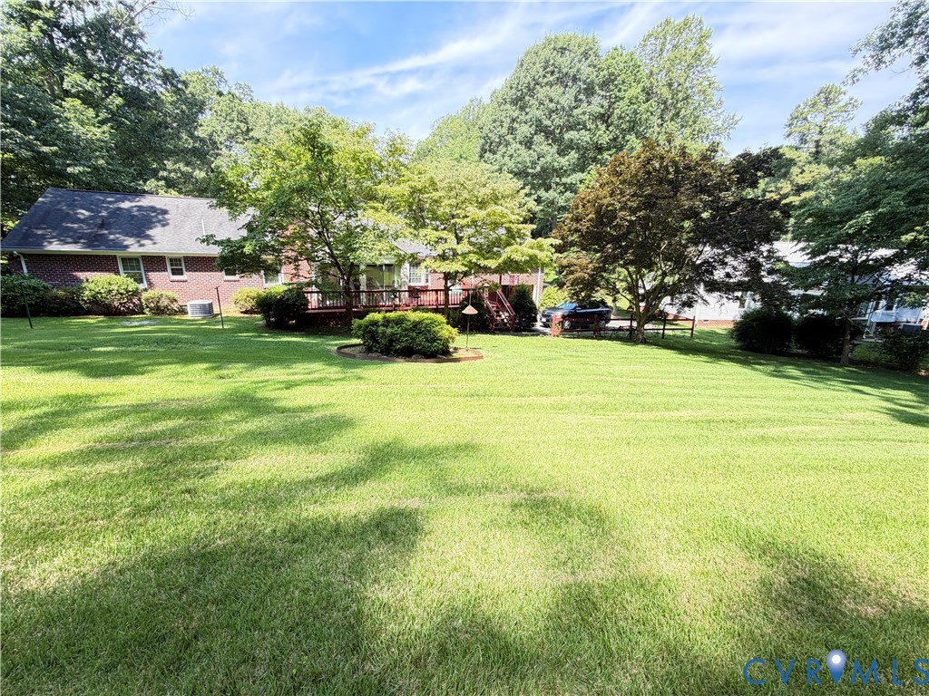 3933 Dunraven Road North Chesterfield, VA 23236 - Photo 9 of 30 a view of a house with a big yard and basketball court