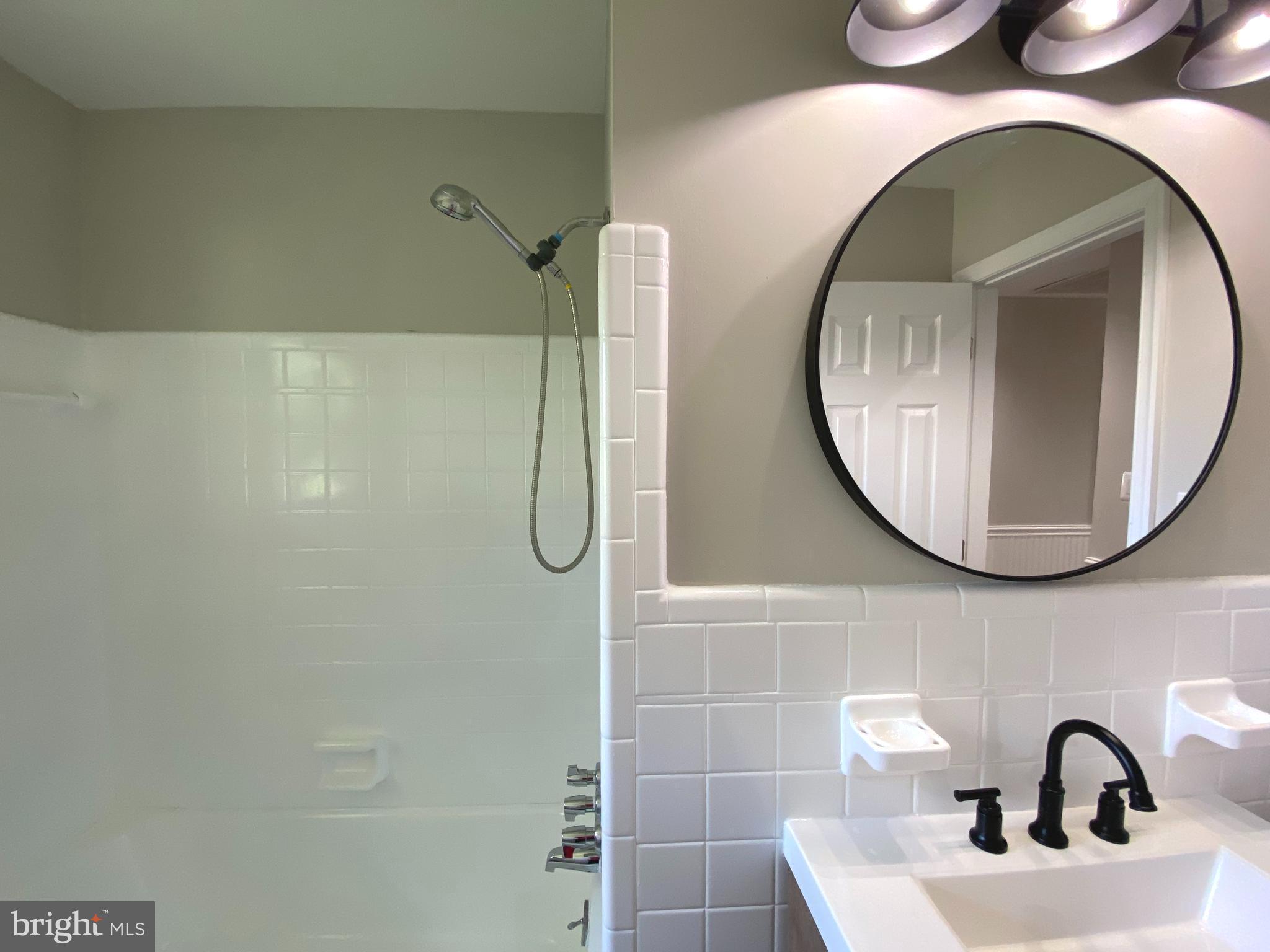 5072 Rock Springs Road Warrenton, VA 20187 - Photo 15 of 28 a bathroom with a sink and mirror