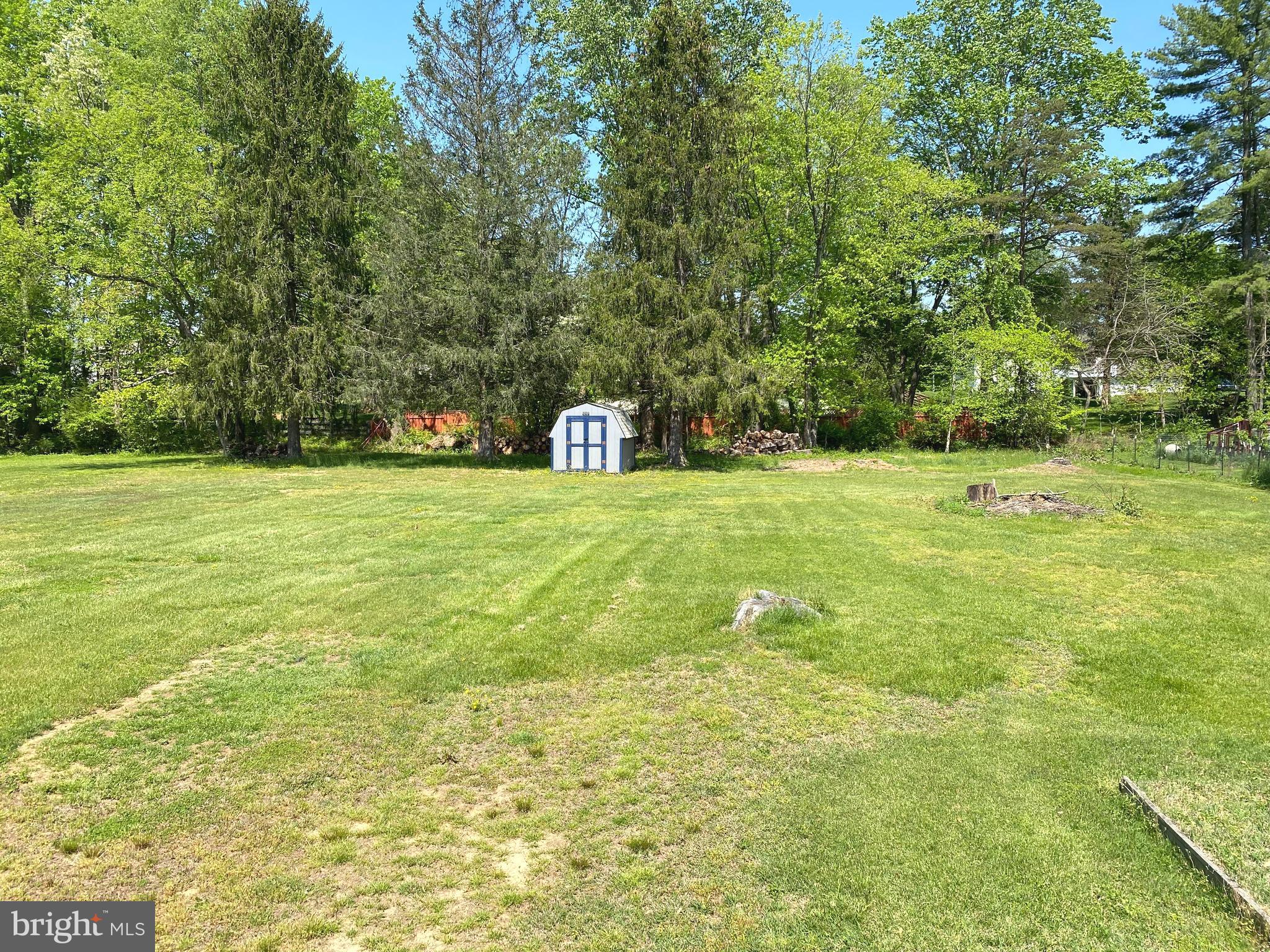 5072 Rock Springs Road Warrenton, VA 20187 - Photo 22 of 28 a view of a big yard with large trees