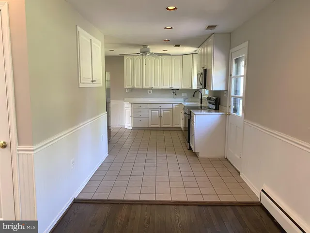 a room with a cabinets and appliances