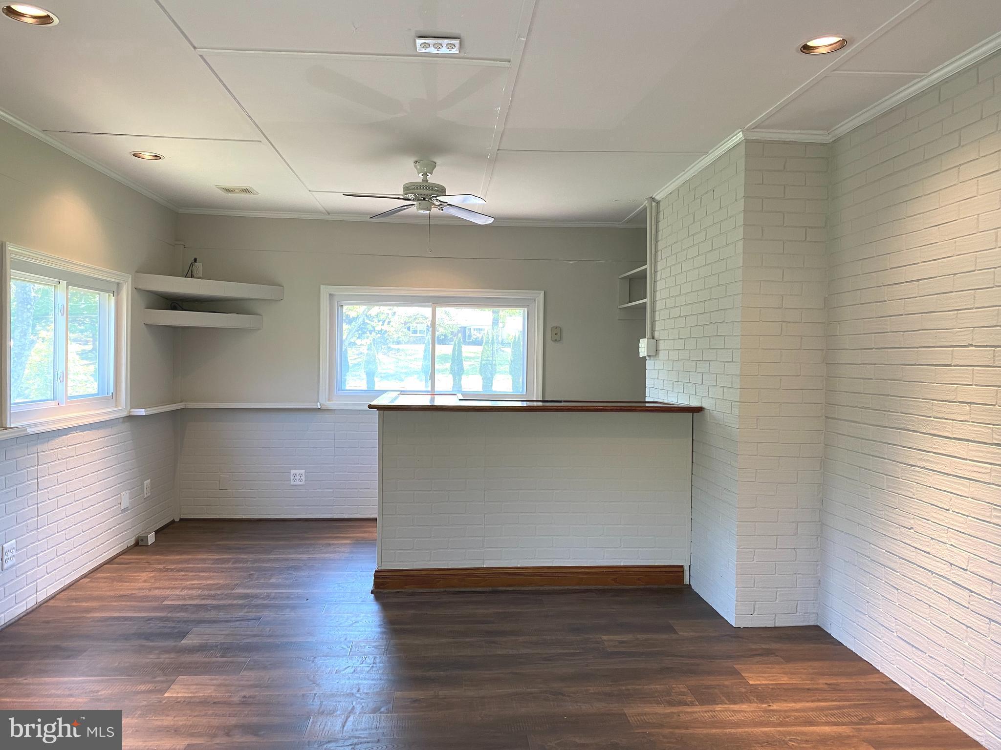 5072 Rock Springs Road Warrenton, VA 20187 - Photo 7 of 28 an empty room with wooden floor and windows