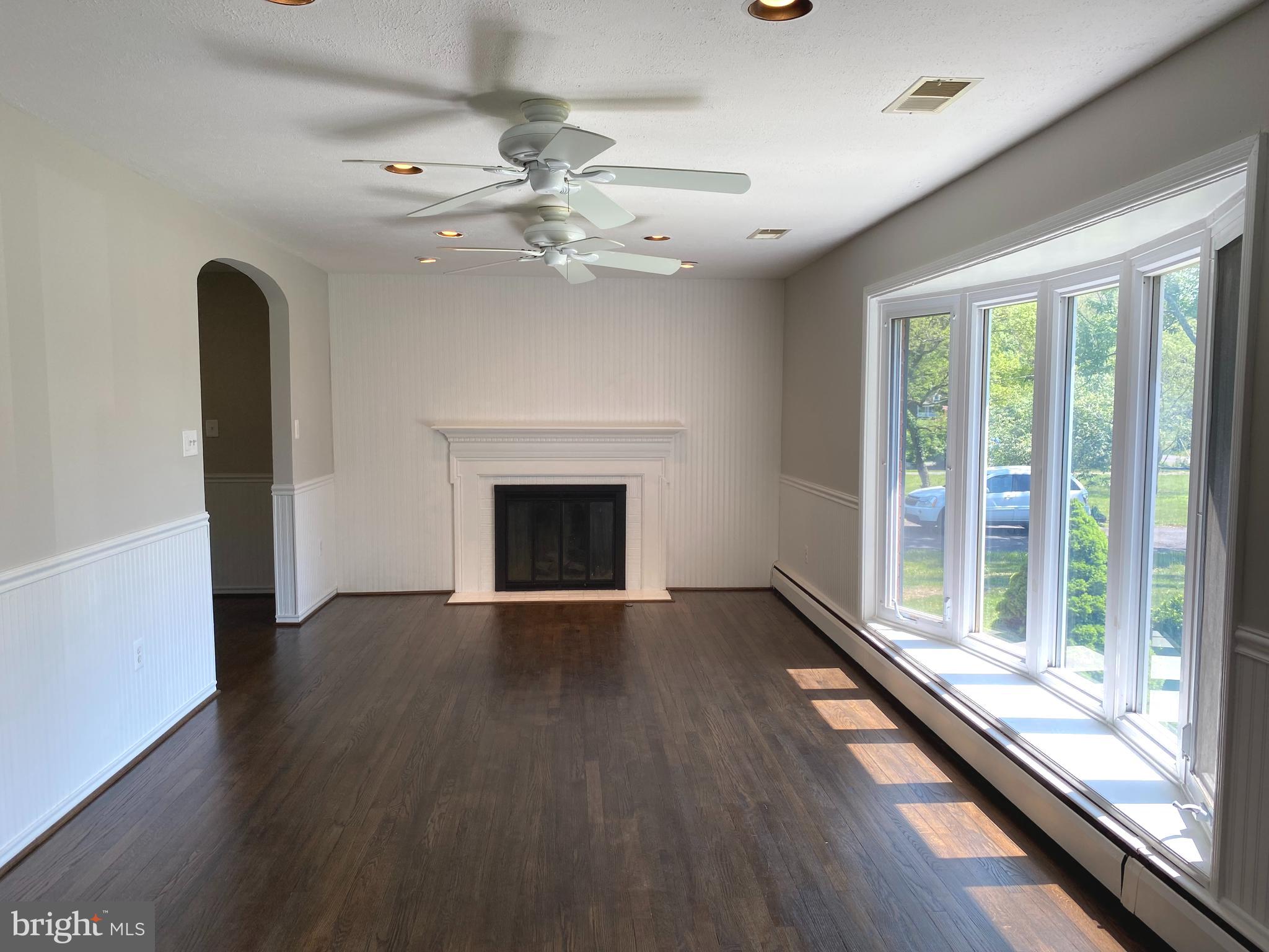5072 Rock Springs Road Warrenton, VA 20187 - Photo 8 of 28 a view of an empty room with wooden floor and a window