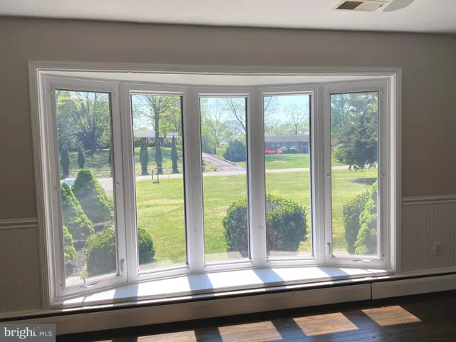 a view of a room with a large window