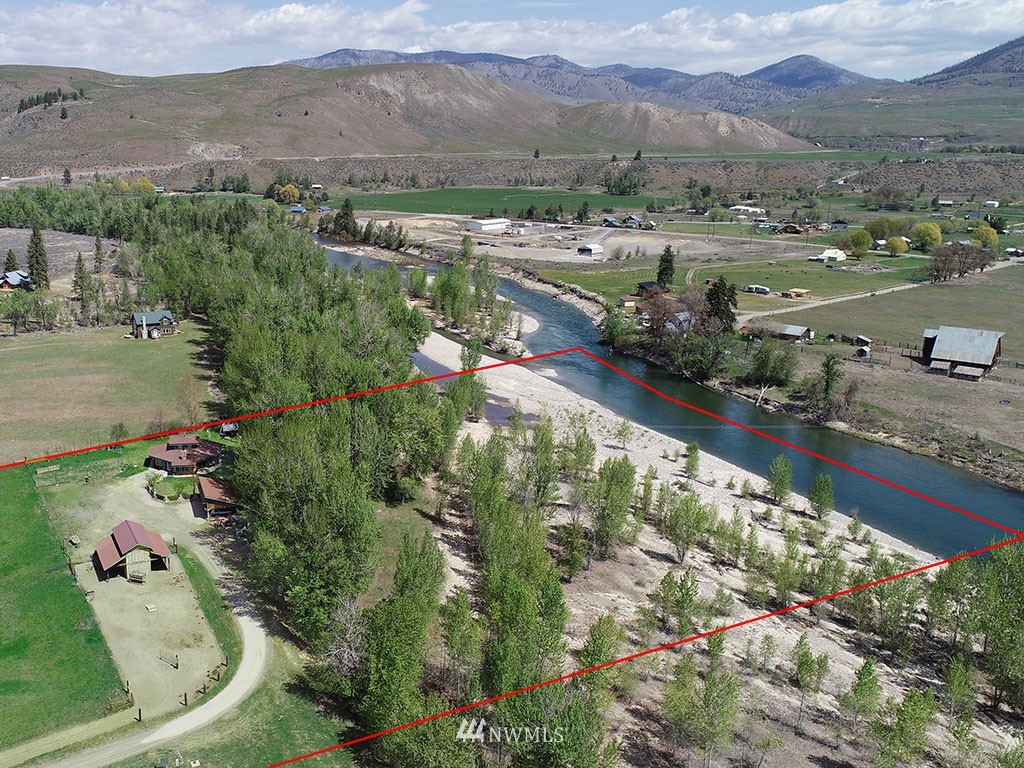 26 Beaver Pond Road Twisp, WA 98856 - Photo 1 of 31 an aerial view of lake residential house with outdoor space
