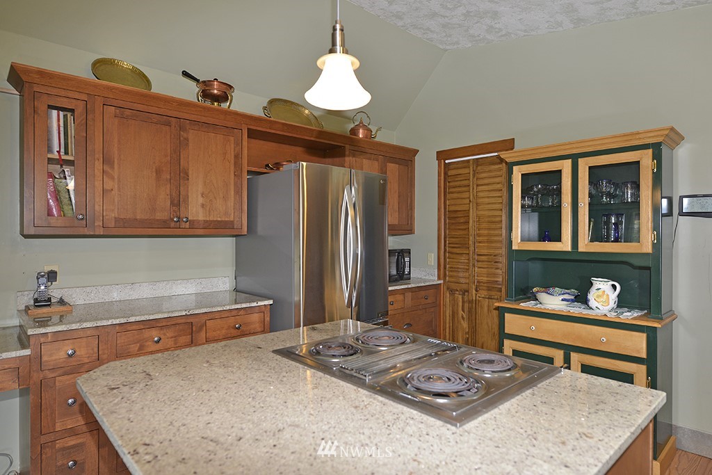 26 Beaver Pond Road Twisp, WA 98856 - Photo 12 of 31 a kitchen with sink refrigerator dining table and chairs