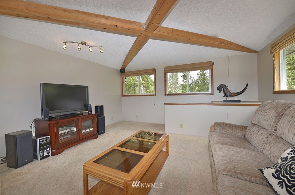 26 Beaver Pond Road Twisp, WA 98856 - Photo 16 of 31 a living room with furniture and a flat screen tv