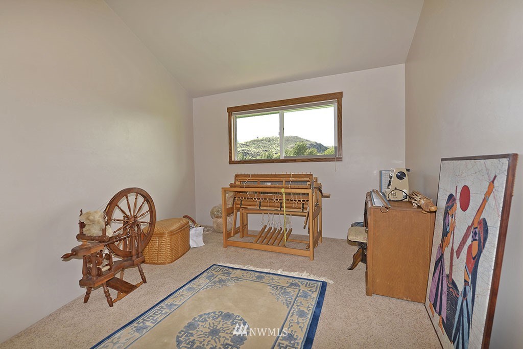 26 Beaver Pond Road Twisp, WA 98856 - Photo 20 of 31 a bedroom with furniture and a window