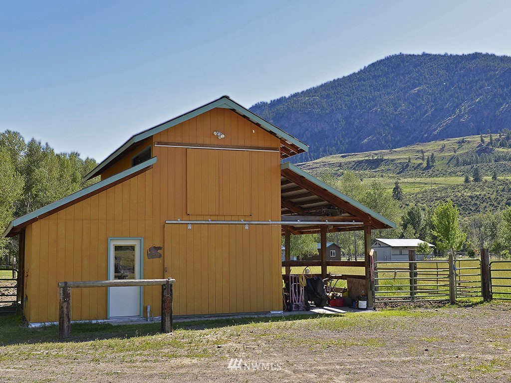 26 Beaver Pond Road Twisp, WA 98856 - Photo 24 of 31 a front view of a house with a yard