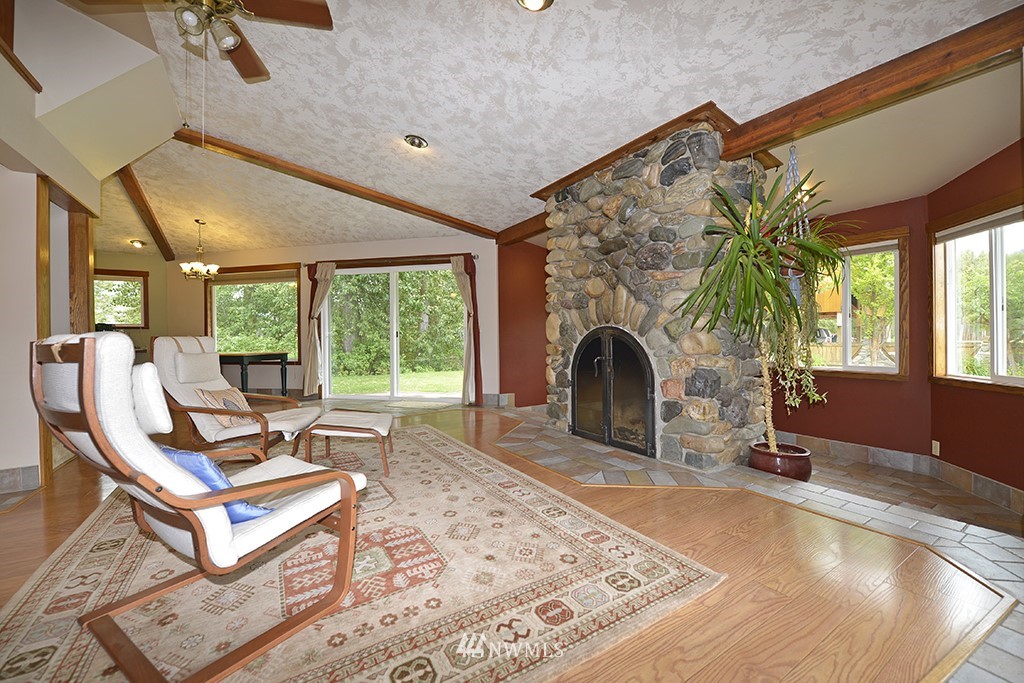 26 Beaver Pond Road Twisp, WA 98856 - Photo 6 of 31 a living room with patio furniture and a fireplace
