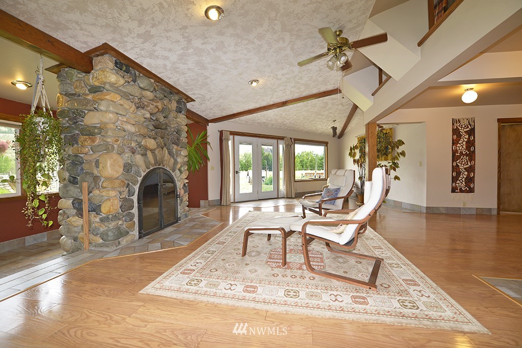 26 Beaver Pond Road Twisp, WA 98856 - Photo 8 of 31 a work room with furniture and a fireplace