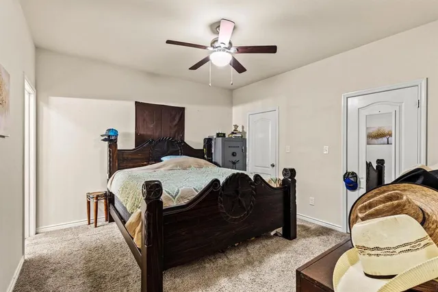 a bed room with a bed and a chandelier