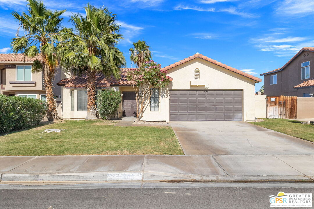 45688 Sutter Creek Road Indio, CA 92201 - Photo 4 of 51 a front view of a house with garden
