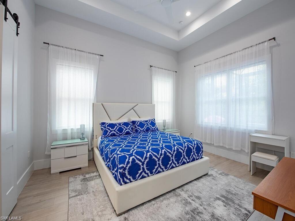 710 Soll Street Naples, FL 34109 - Photo 11 of 12 a bedroom with a bed and window