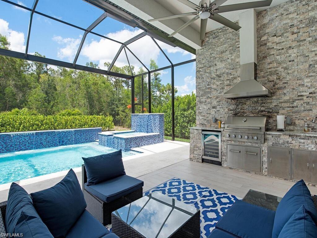 710 Soll Street Naples, FL 34109 - Photo 4 of 12 a outdoor living space with furniture and garden view