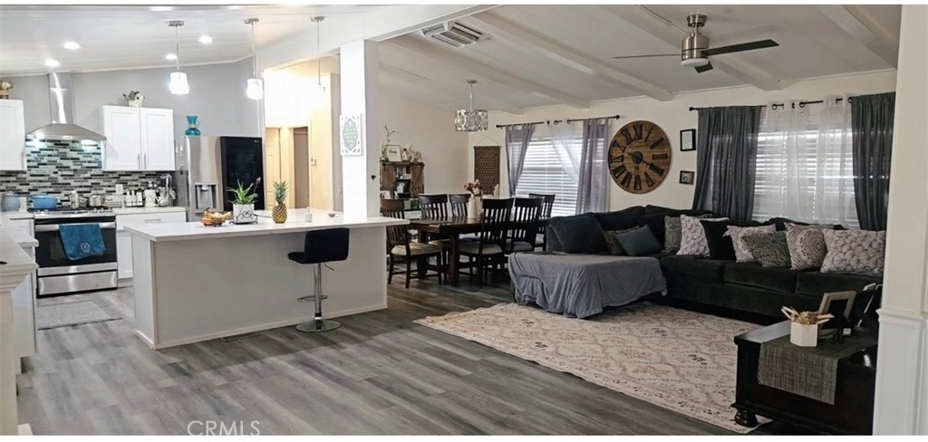 20683 Waalew Road, Unit B190 Apple Valley, CA 92307 - Photo 11 of 26 a living room with furniture and a large window