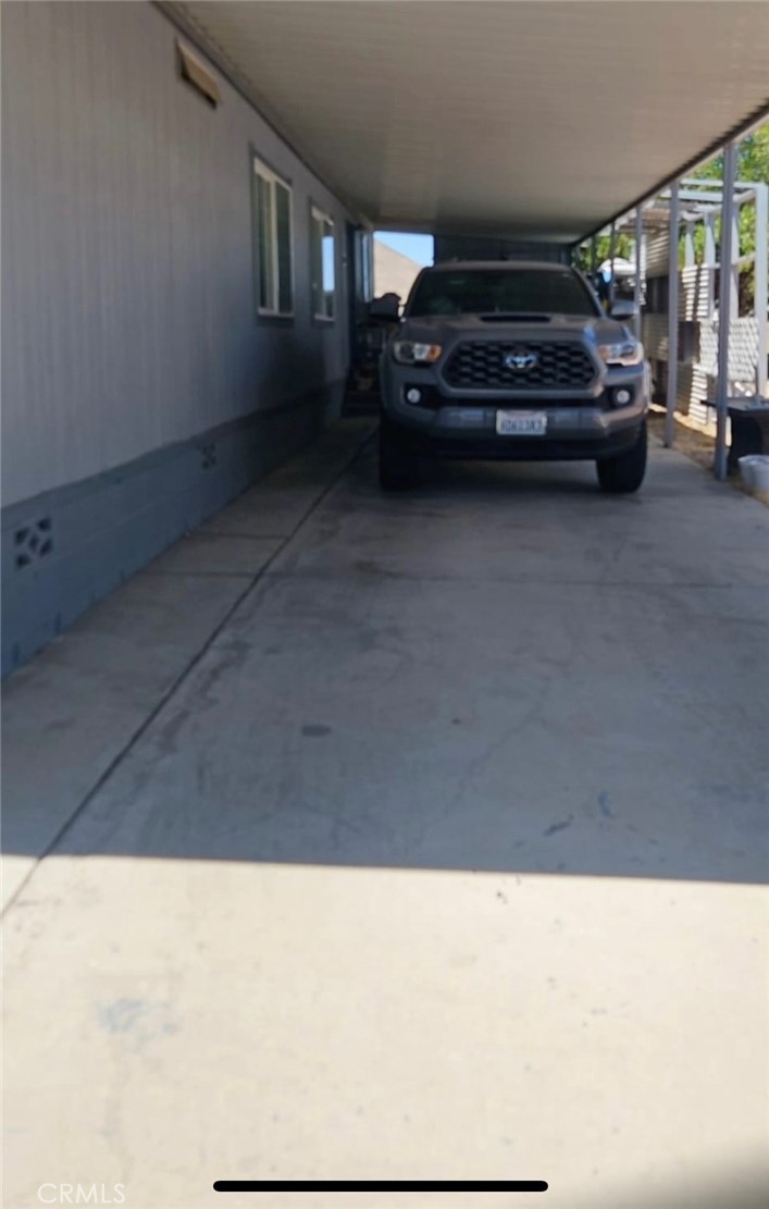 20683 Waalew Road, Unit B190 Apple Valley, CA 92307 - Photo 22 of 26 a view of car parked in garage