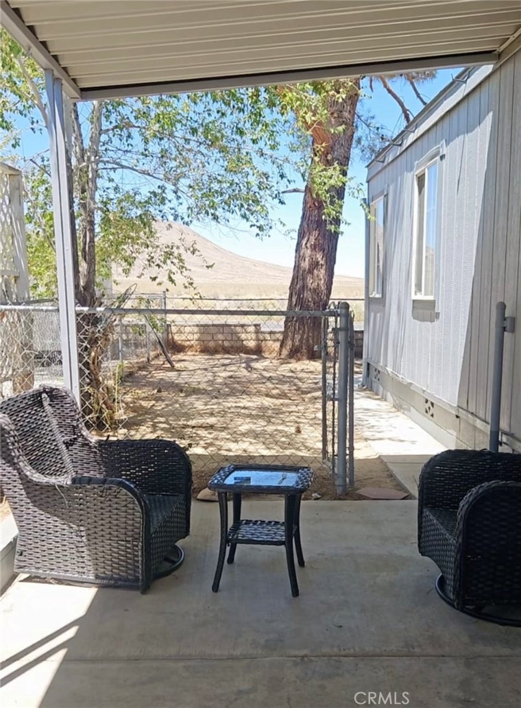 20683 Waalew Road, Unit B190 Apple Valley, CA 92307 - Photo 24 of 26 a living room with a window and furniture