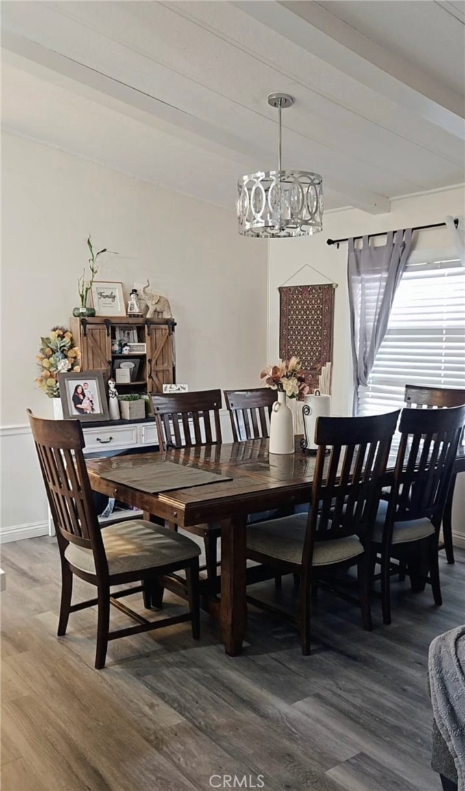 20683 Waalew Road, Unit B190 Apple Valley, CA 92307 - Photo 8 of 26 a view of a dining room with furniture and wooden floor