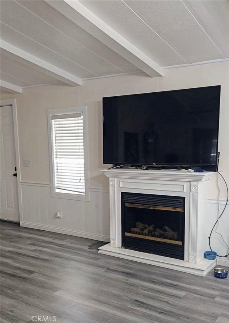 20683 Waalew Road, Unit B190 Apple Valley, CA 92307 - Photo 10 of 26 a view of empty room with wooden floor and fireplace