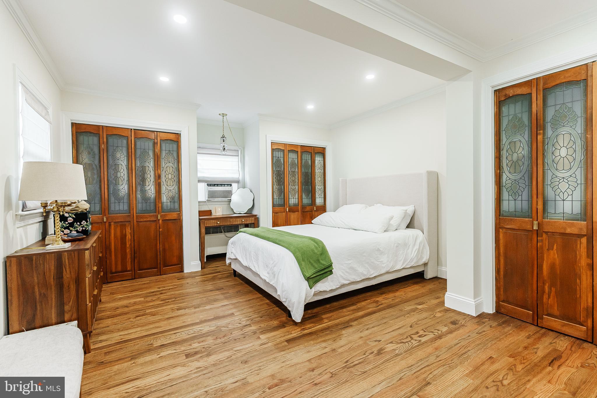 138 Summit Avenue Langhorne, PA 19047 - Photo 12 of 17 a spacious bedroom with a bed and wooden floor