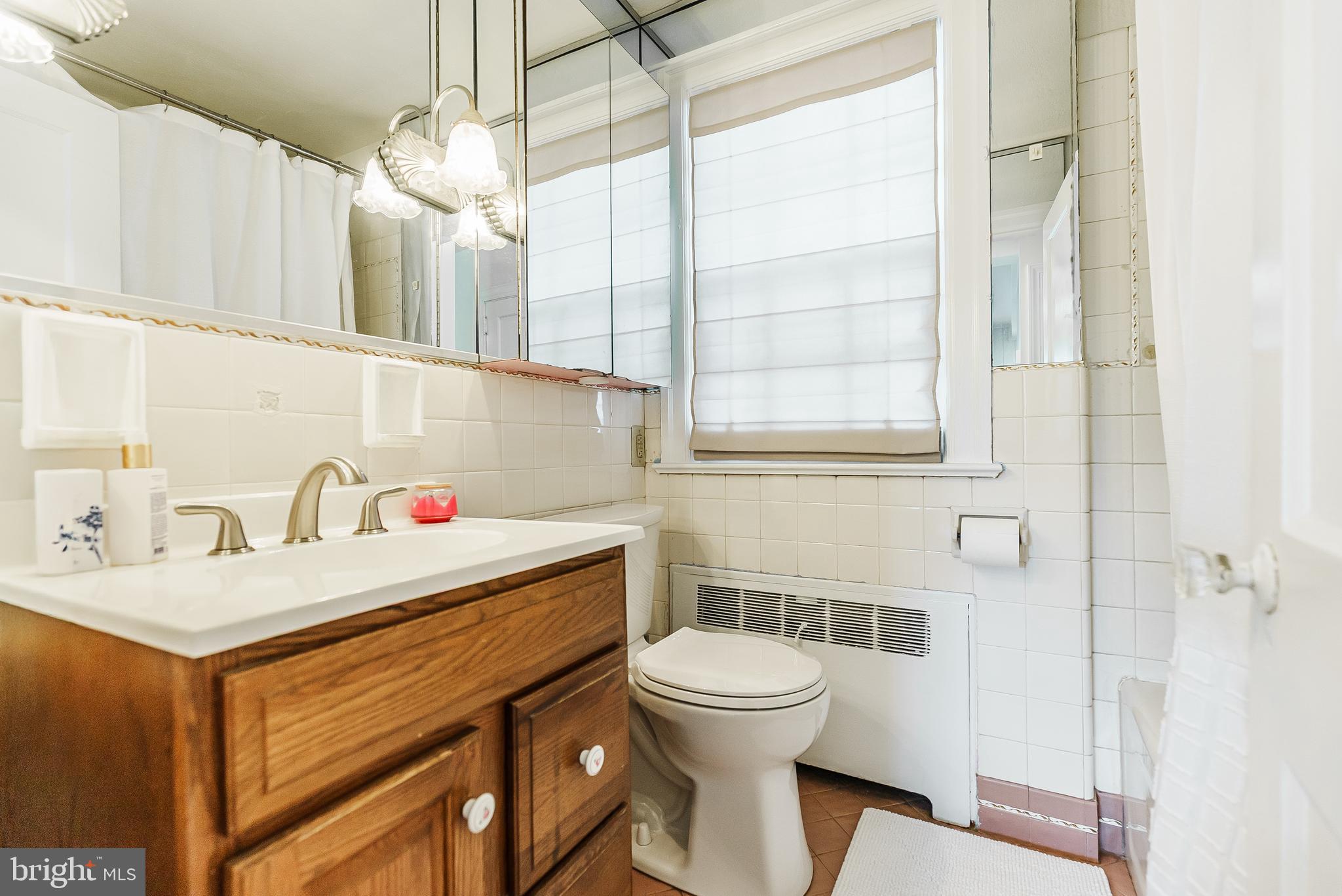 138 Summit Avenue Langhorne, PA 19047 - Photo 13 of 17 a bathroom with a sink a toilet and shower