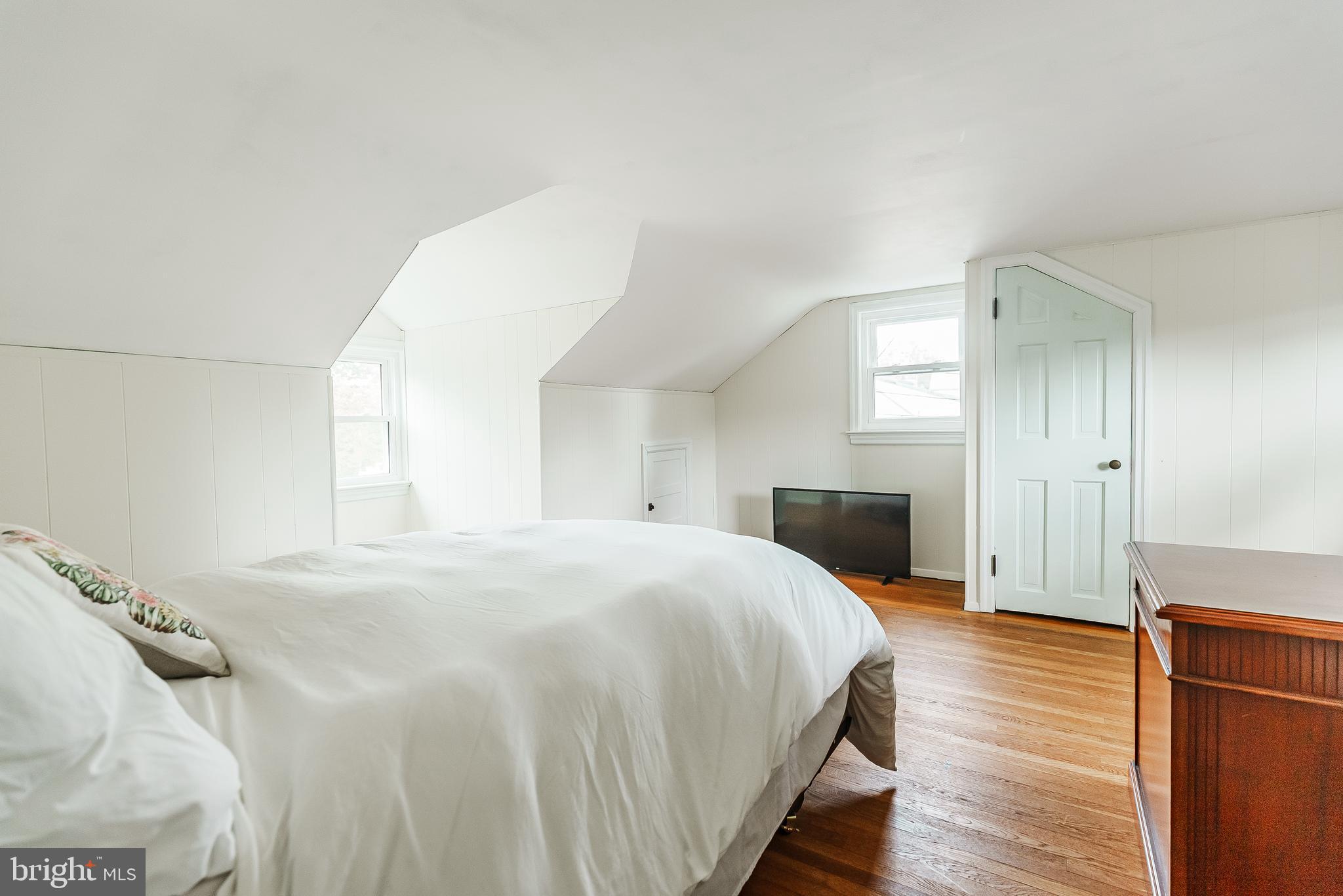 138 Summit Avenue Langhorne, PA 19047 - Photo 15 of 17 a bedroom with a bed and wooden floor