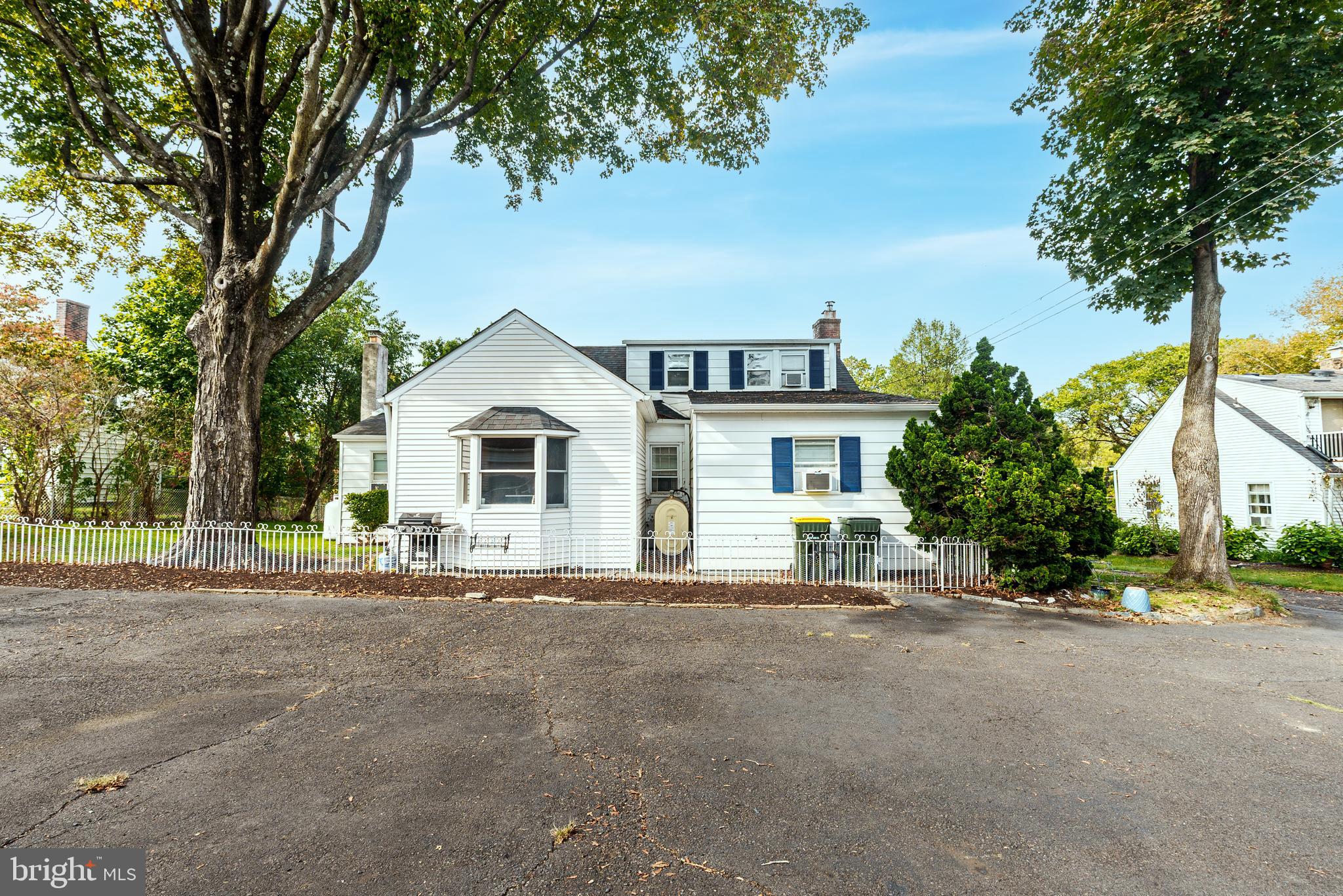 138 Summit Avenue Langhorne, PA 19047 - Photo 3 of 17 a front view of a house with a garden and trees