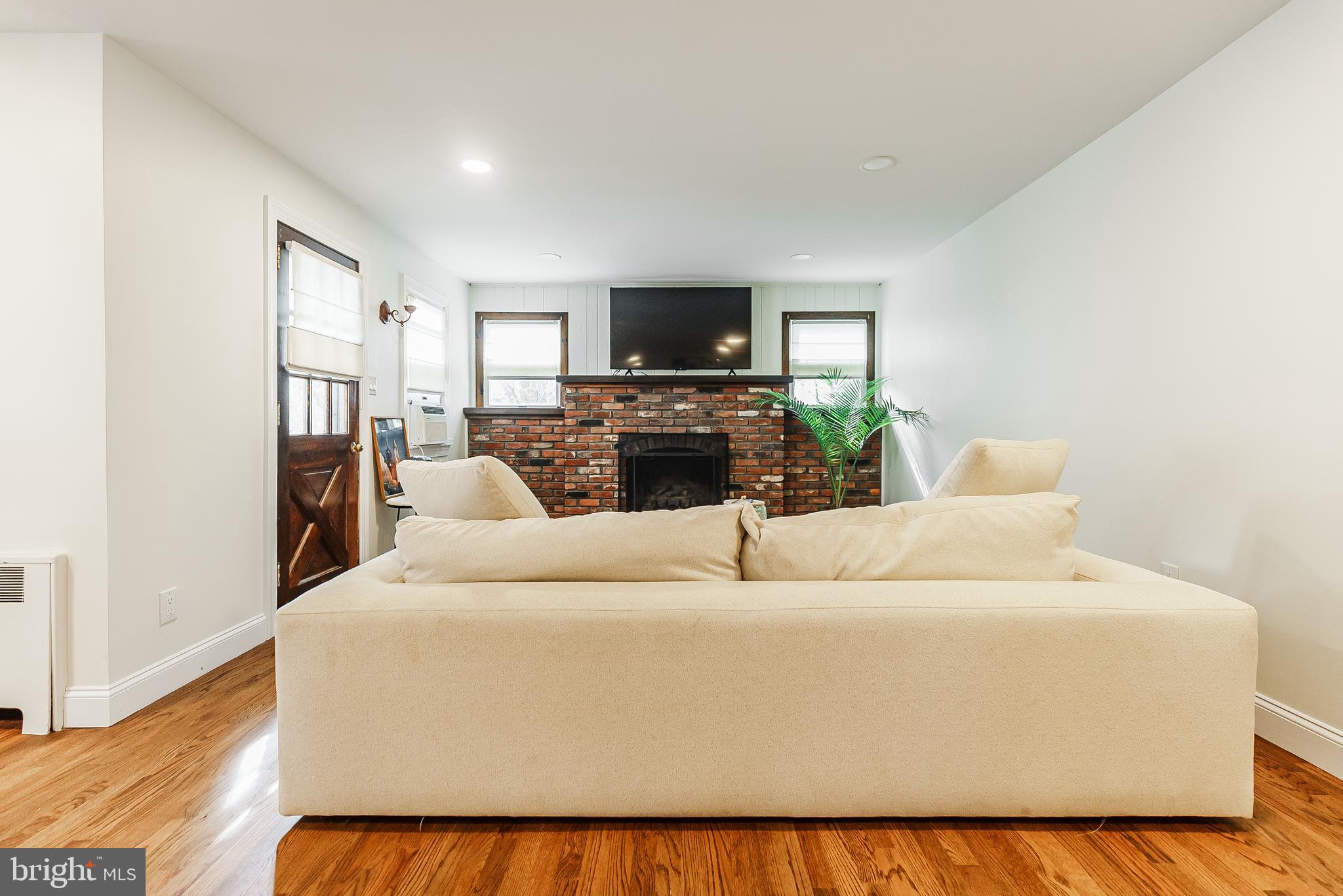 138 Summit Avenue Langhorne, PA 19047 - Photo 8 of 17 a living room with furniture and a flat screen tv