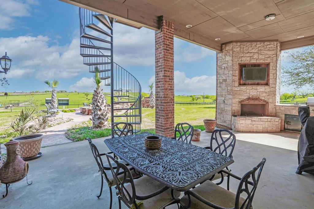 1200 McReynolds Road Sanger, TX 76266 - Photo 4 of 20 a view of an outdoor dining space with furniture and garden view
