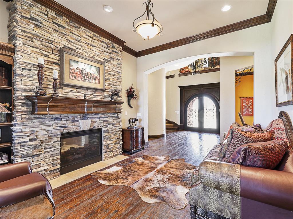 1200 McReynolds Road Sanger, TX 76266 - Photo 9 of 20 a living room with furniture and a fireplace