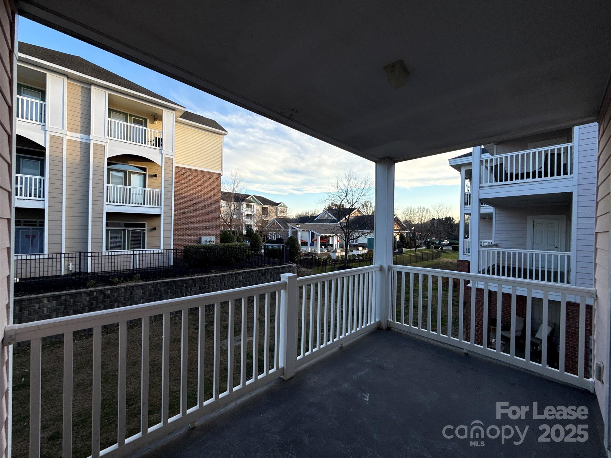 9068 Meadow Vista Road Charlotte, NC 28213 - Photo 11 of 13 a view of a street from a balcony