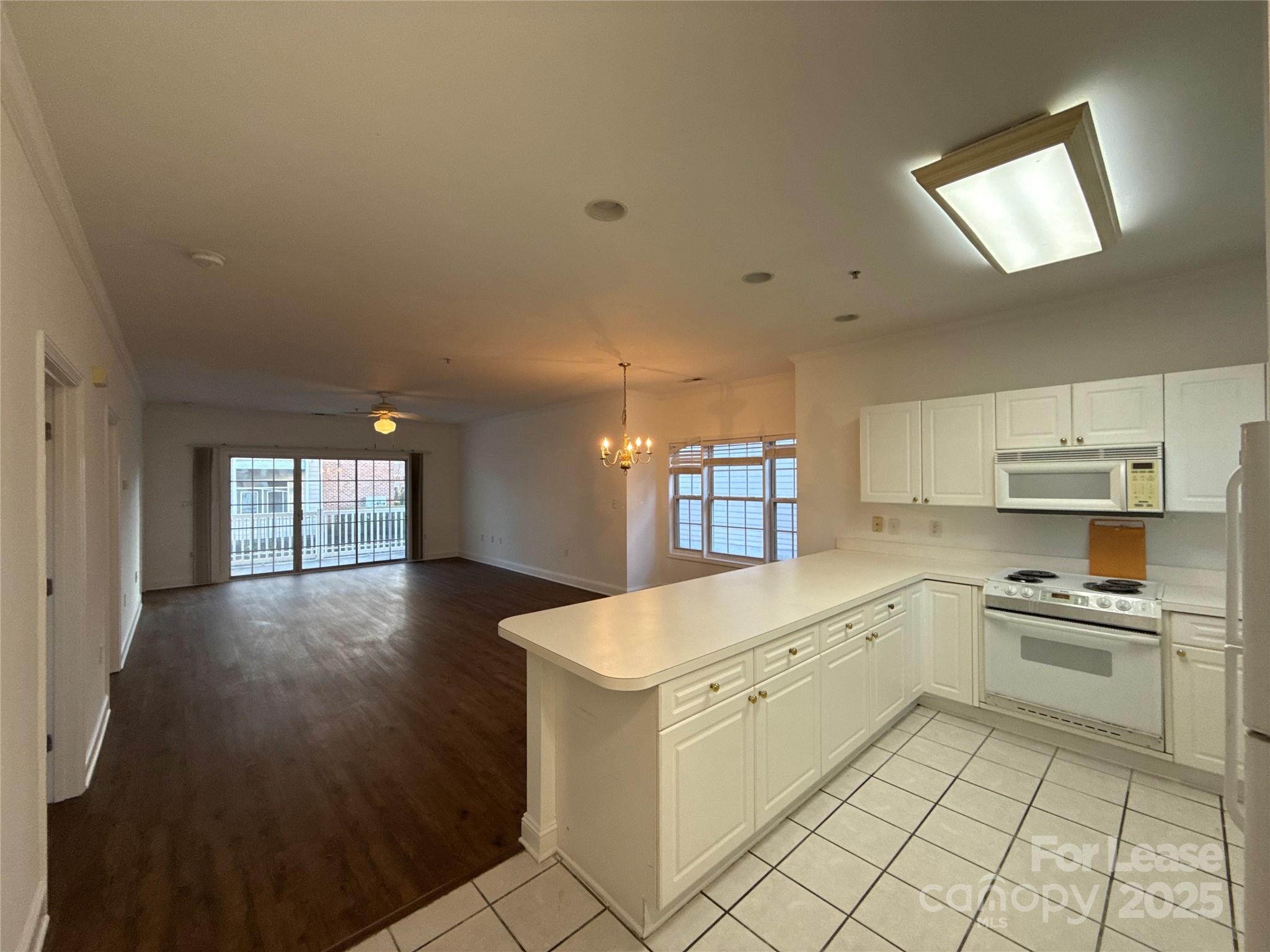 9068 Meadow Vista Road Charlotte, NC 28213 - Photo 4 of 13 a kitchen with a cabinets and white appliances