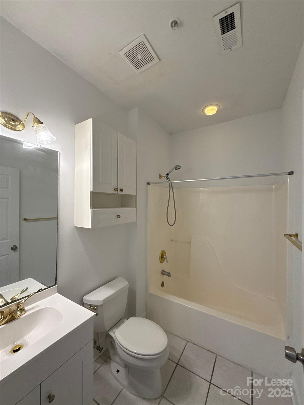 9068 Meadow Vista Road Charlotte, NC 28213 - Photo 8 of 13 a bathroom with a sink a toilet and shower